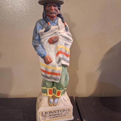 Lionstone "Proud Indian" (or "Casual Indian") porcelain whiskey decanter. -empty