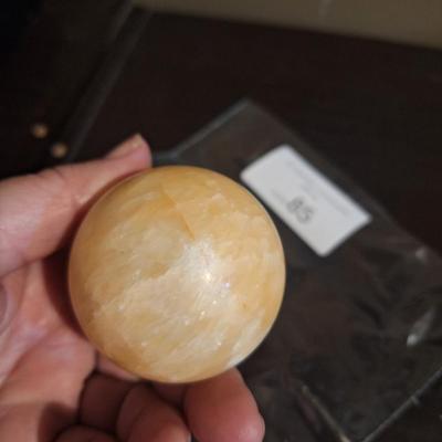 polished stone ball…calcite, onyx…we aren't sure the type of stone.