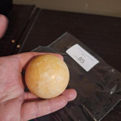 polished stone ball…calcite, onyx…we aren't sure the type of stone.