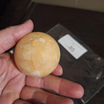 polished stone ball…calcite, onyx…we aren't sure the type of stone.