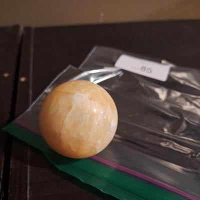 polished stone ball…calcite, onyx…we aren't sure the type of stone.