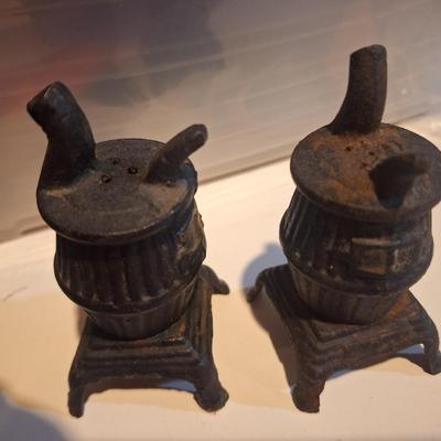 vintage cast iron miniature pot belly stoves- salt and pepper shakers