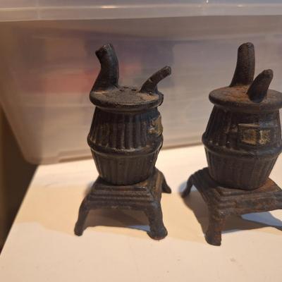 vintage cast iron miniature pot belly stoves- salt and pepper shakers