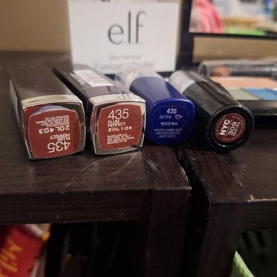 cosmetics bundle, elf eyelash curler, mary kay compact and varios other items