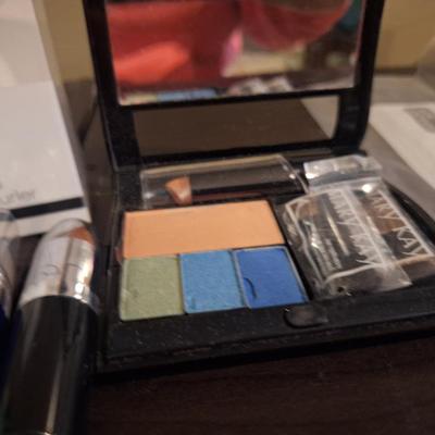cosmetics bundle, elf eyelash curler, mary kay compact and varios other items