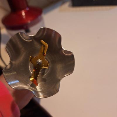 Red and silver immersion hand blender that also has a base- use it either way.