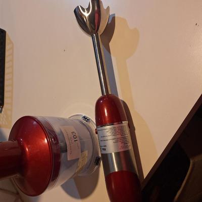 Red and silver immersion hand blender that also has a base- use it either way.