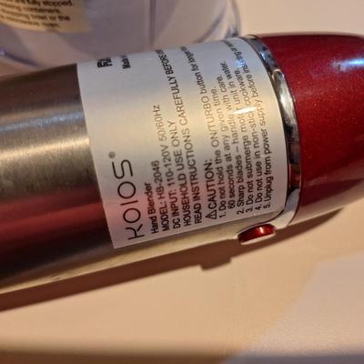 Red and silver immersion hand blender that also has a base- use it either way.