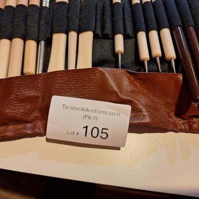 pottery and clay sculpting tool set in a brown roll-up carrying case. 