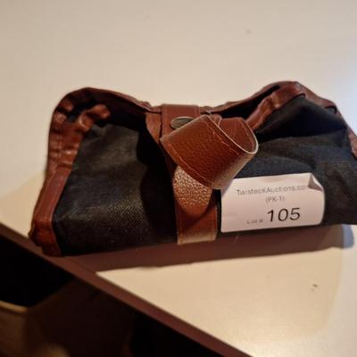 pottery and clay sculpting tool set in a brown roll-up carrying case. 