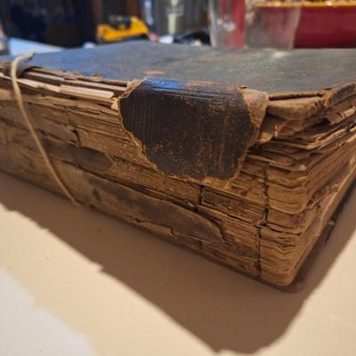 This is a WELL used large bible, has to be tied with string to hold the cover.  See all photos.
