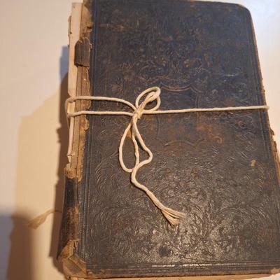 This is a WELL used large bible, has to be tied with string to hold the cover.  See all photos.