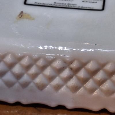 commemorative milk glass ashtray celebrating the first moon landing by Apollo 11 in July 1969. 