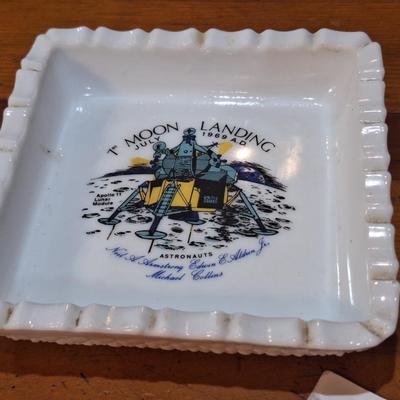commemorative milk glass ashtray celebrating the first moon landing by Apollo 11 in July 1969. 