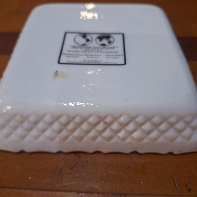 commemorative milk glass ashtray celebrating the first moon landing by Apollo 11 in July 1969. 