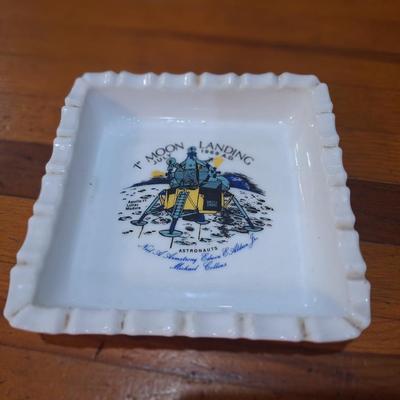commemorative milk glass ashtray celebrating the first moon landing by Apollo 11 in July 1969. 