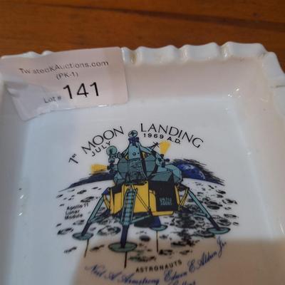 commemorative milk glass ashtray celebrating the first moon landing by Apollo 11 in July 1969. 