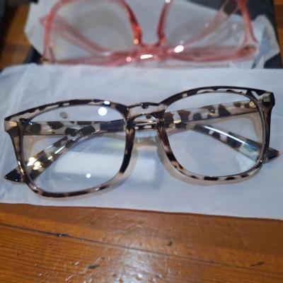  GROYE Designers Milan blue light blocking glasses in clear, pink, and leopard print frames. 