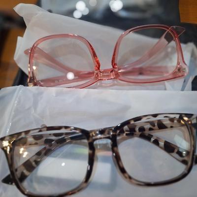  GROYE Designers Milan blue light blocking glasses in clear, pink, and leopard print frames. 