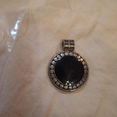 round silvertone pendant