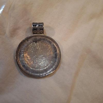 round silvertone pendant
