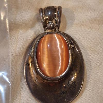 oval pendant silver town with orange stone