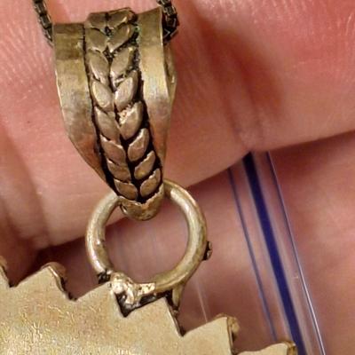 Sterling silver pendant with multi color glass or other stone inlays