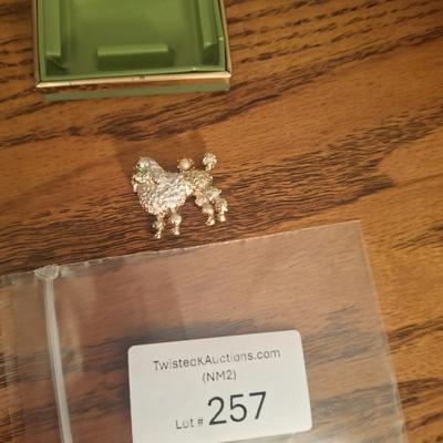 vintage Griffith gold tone and rhinestone poodle dog brooch in box.