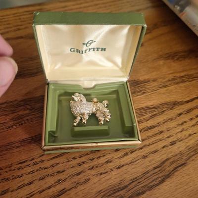 vintage Griffith gold tone and rhinestone poodle dog brooch in box.