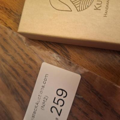 Kukio handmade earrings with blue and green stones 