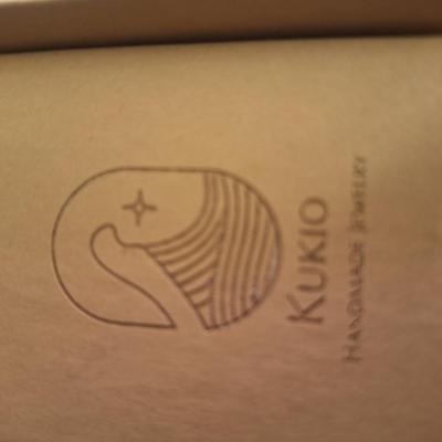 Kukio handmade earrings with blue and green stones 