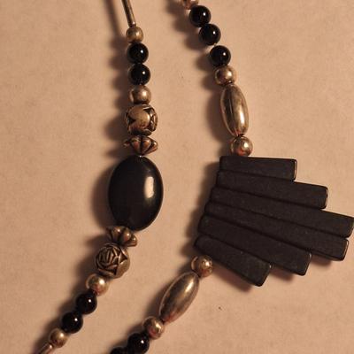 double strand necklace featuring black onyx and silver beads