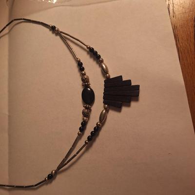 double strand necklace featuring black onyx and silver beads