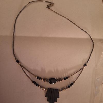 double strand necklace featuring black onyx and silver beads
