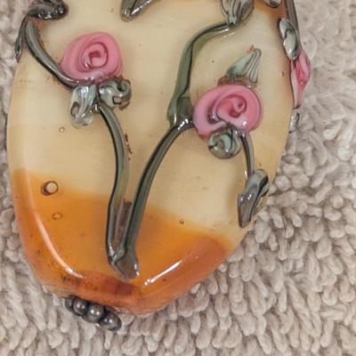 vintage pendant with oval stone and pink rose embellishments
