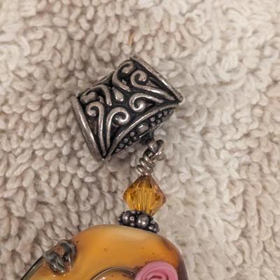 vintage pendant with oval stone and pink rose embellishments