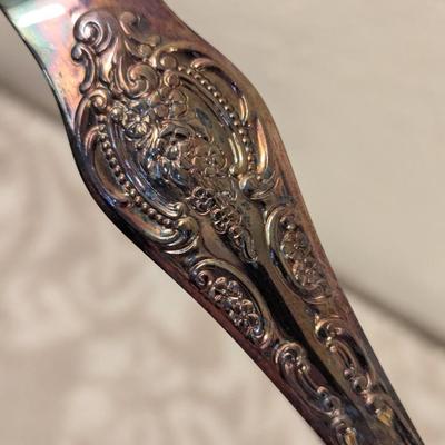 vintage silverplate sugar tongs with talon or claw style ends. By Wallace