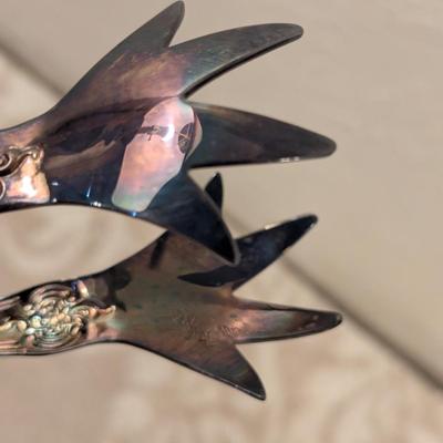 vintage silverplate sugar tongs with talon or claw style ends. By Wallace