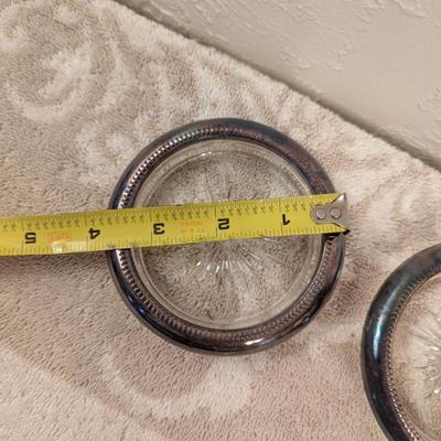 four vintage Italian Leonard silver-plated glass coasters with a starburst design