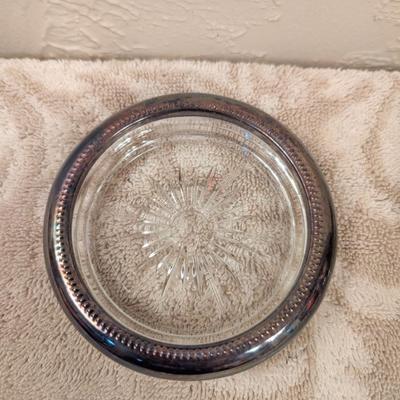 four vintage Italian Leonard silver-plated glass coasters with a starburst design