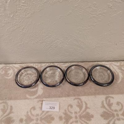four vintage Italian Leonard silver-plated glass coasters with a starburst design