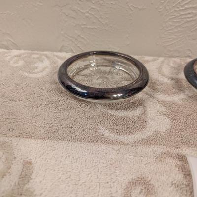 four vintage Italian Leonard silver-plated glass coasters with a starburst design