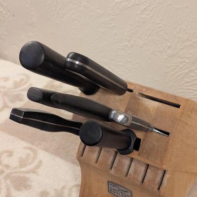 parital set of chicago cutlery knives and wooden block see all photos.