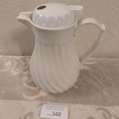 Connoisserve white insulated carafe or beverage server with a swirl design