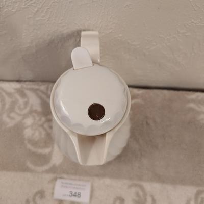 Connoisserve white insulated carafe or beverage server with a swirl design