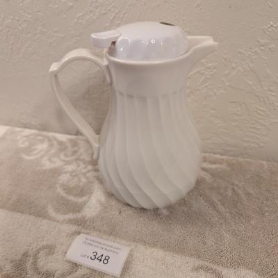 Connoisserve white insulated carafe or beverage server with a swirl design