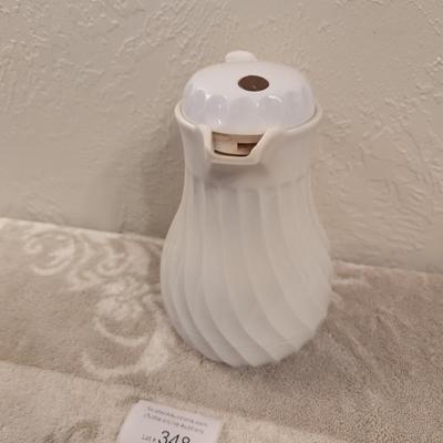 Connoisserve white insulated carafe or beverage server with a swirl design