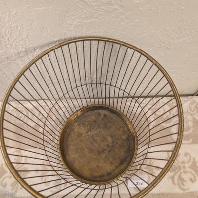 antique "Daisy" wire waste basket made by The Massillon Wire Basket Co. in Massillon, Ohio, which features a patent date of...