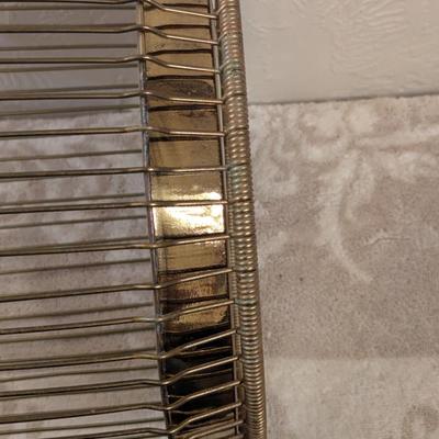 antique "Daisy" wire waste basket made by The Massillon Wire Basket Co. in Massillon, Ohio, which features a patent date of...