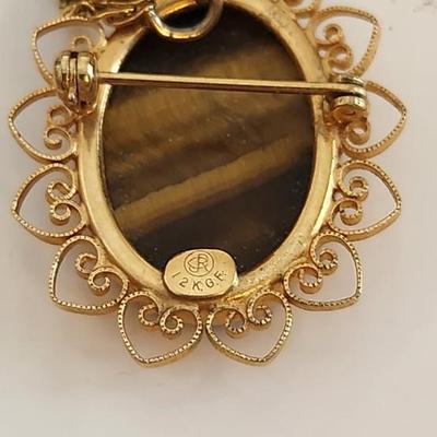 Sale Photo Thumbnail #389: This lot is for a Monet Onyx Pendant in 12KGF Mounting.  This handsome necklace sports a nice sliced onyx stone.  The chain is marked Monet but appears to be a gold-toned metal.